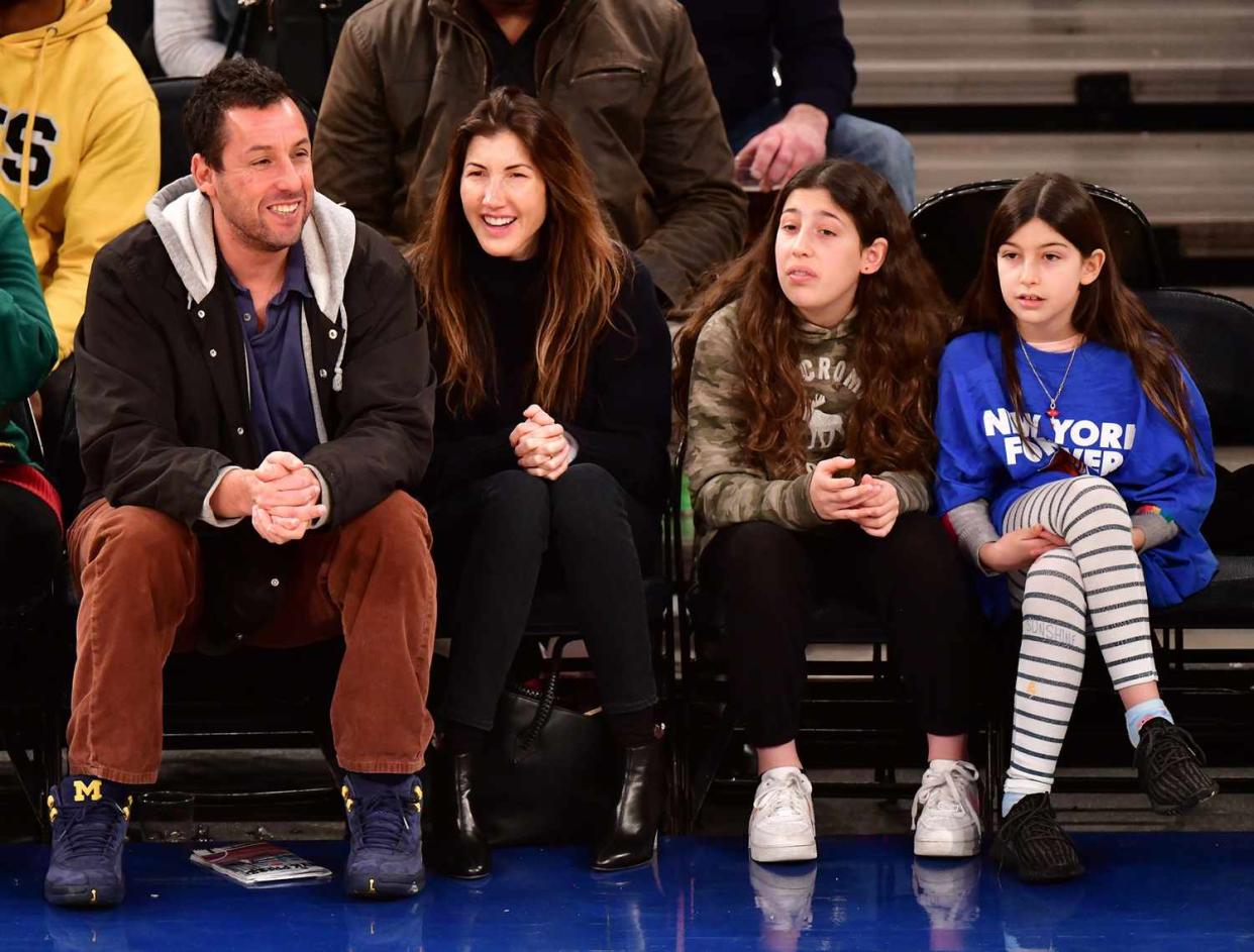 Adam Sandler, Jackie Sandler, Sadie Sandler and Sunny Sandler attend Milwaukee Bucks v New York Knicks game at Madison Square Garden on December 25, 2018 in New York City