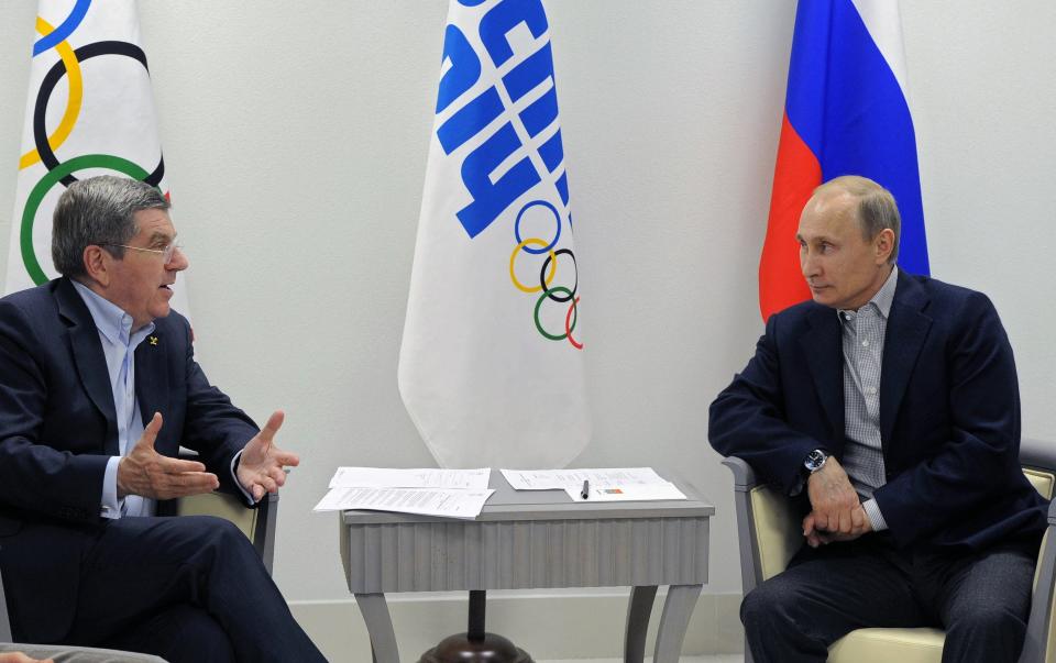 FILE - In this Feb. 15, 2014 file photo Russian President Vladimir Putin, right, and IOC President Thomas Bach meet in the Bolshoi Ice Dome in Sochi, Russia. The question of if and how Russia competes at the Olympics hangs over the 2024 Paris Summer Games. Just as it has now for five straight Olympics during Thomas Bach’s leadership of the IOC. The Bach-led International Olympic Committee's support this week for some Russians to compete in Paris as neutrals was publicly challenged Friday, Jan. 27, 2023 by Ukrainian President Volodymyr Zelenskyy. (RIA-Novosti, Mikhail Klimentyev, Presidential Press Service via AP, file)
