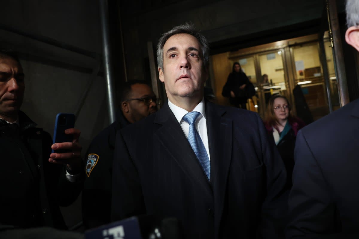 Michael Cohen walks out of a Manhattan courthouse after testifying before a grand jury in the hush money case (Getty Images)