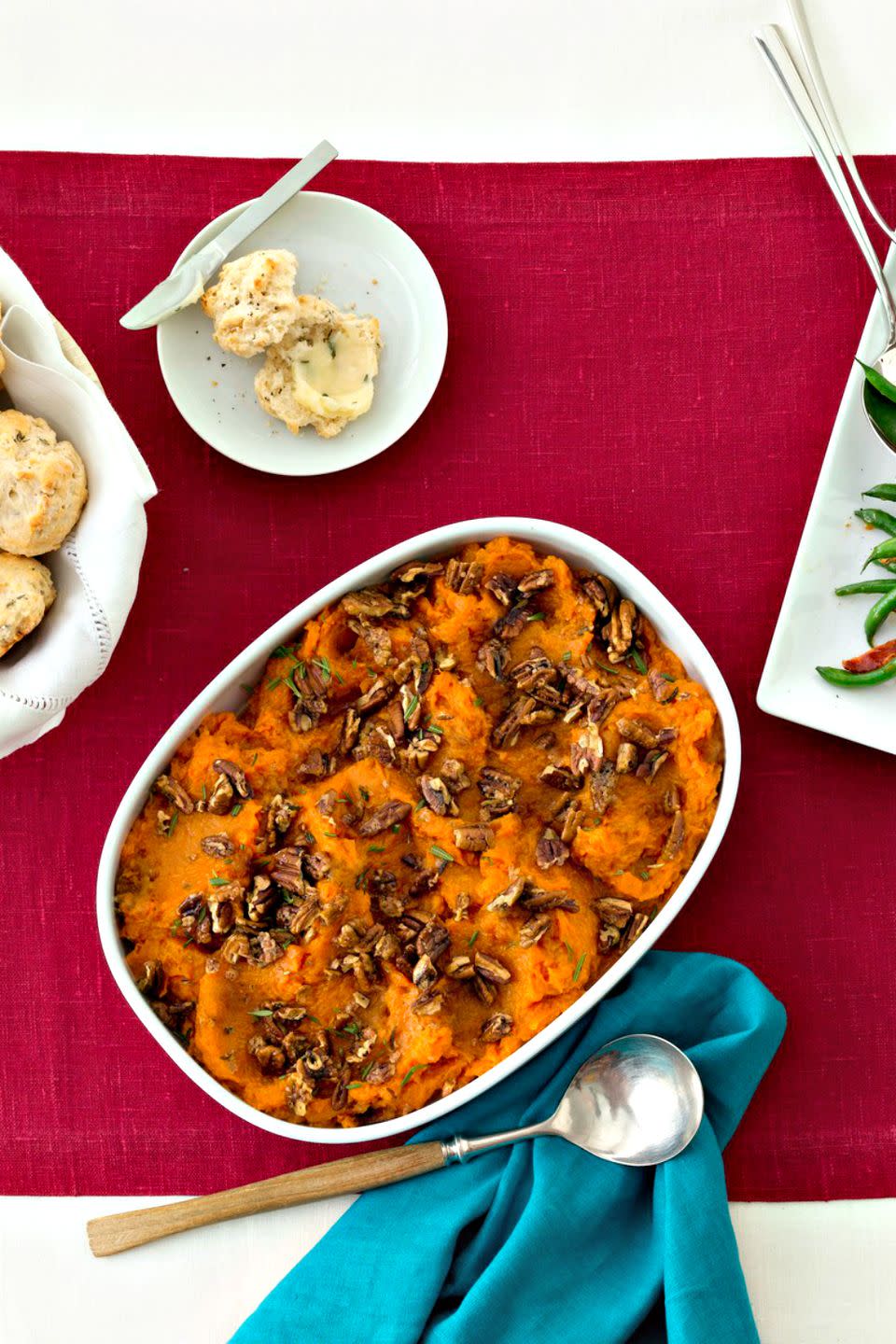 <p>Not a fan of marshmallow-covered sweet potatoes? Go the savory route with these mashed potatoes that feature rosemary-roasted pecans.</p><p><a href="https://www.womansday.com/food-recipes/food-drinks/recipes/a12148/mashed-sweet-potatoes-rosemary-pecans-recipe-wdy1112/" rel="nofollow noopener" target="_blank" data-ylk="slk:Get the Mashed Sweet Potatoes with Rosemary Pecans recipe.;elm:context_link;itc:0;sec:content-canvas" class="link "><em><strong>Get the Mashed Sweet Potatoes with Rosemary Pecans recipe.</strong></em></a> </p>