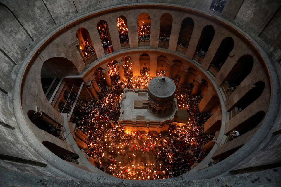 Worshippers hold candles in Jerusalem’s Old City