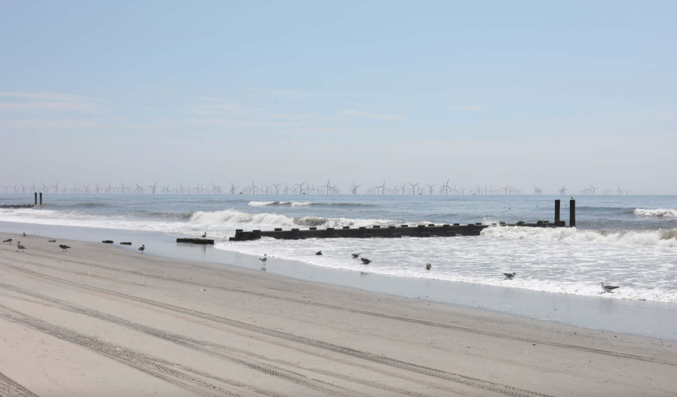 A photo illustration from Atlantic Shores environmental impact documents shows how the turbines might look on a clear day from a beach in Atlantic City.