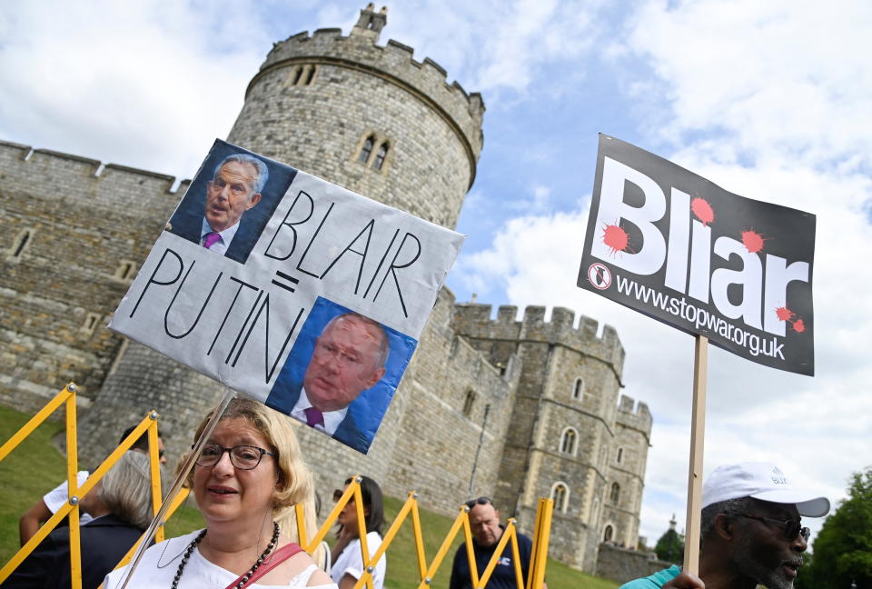 Protesters demonstrate outside of Windsor Castle opposing the knighthood of former British Prime Minister Tony Blair, in Windsor, Britain June 13, 2022. REUTERS/Toby Melville