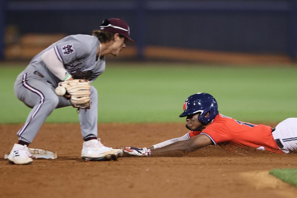Ole Miss Rebelsâ€™ TJ McCants slides in safely at second base against the Mississippi State Bulldogs at Oxford-University Stadium on Thursday, April 21, 2022. 