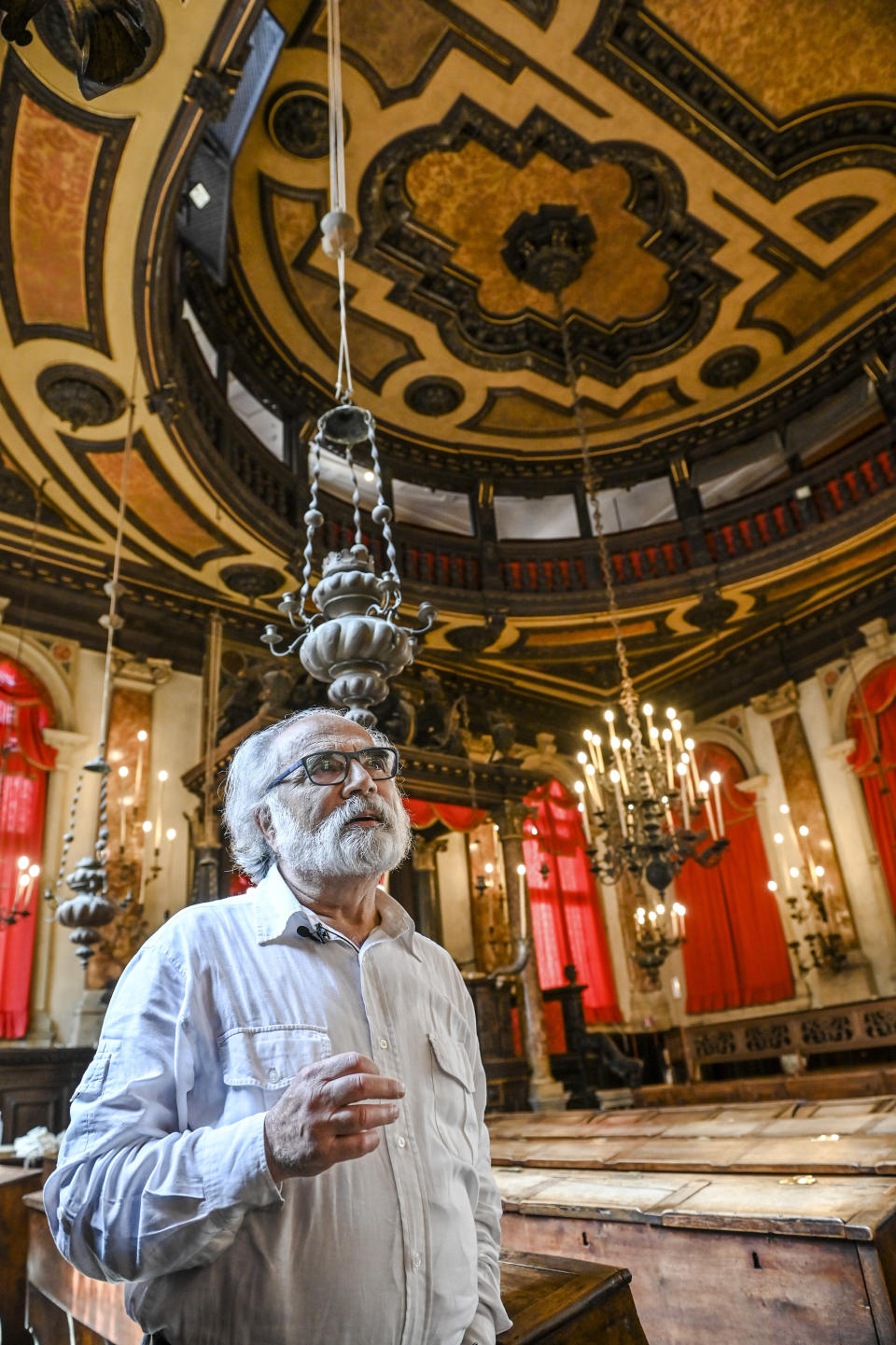 Dario Calimani, the president of the Jewish Community of Venice, poses inside the Spanish Schola Synagogue in Venice, northern Italy, Wednesday, June 1, 2022. The Spanish Schola, founded about 1580, but rebuilt in the first half of the 17th century, is the biggest of the Venetian synagogues. Venice’s Jewish ghetto is considered the first in Europe and one of the first in the world, and a new effort is underway to preserve its 16th century synagogues for the Jews who have remained and tourists who pass through. (AP Photo/Chris Warde-Jones)