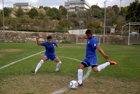 Players from Ariel Municipal Soccer Club, who are affiliated with Israel Football Association, train ahead of their match with Maccabi HaSharon Netanya at Ariel Municipal Soccer Club's training grounds in the West Bank Jewish settlement of Ariel September 23, 2016. Picture taken September 23, 2016. REUTERS/Amir Cohen