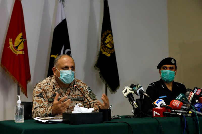 Director General Rangers Sindh Major General Omer Bukhari along with Police Chief Ghulam Nabi Memon addresses a joint news conference, following an attack on the Pakistan Stock Exchange, in Karachi