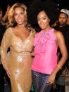 <p>Beyonce, wearing a J.Crew Venture Sequin dress, with her sister Solange at the J.Crew Spring 2012 fashion show in September.</p>