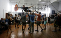 Players from Rice University's baseball team, which had to cancel four of their five exhibition games against Cuban professional teams when Fidel Castro died during their visit here, joke during a visit to Cuba's National Ballet School in Havana, Cuba, December 1, 2016. REUTERS/Stringer