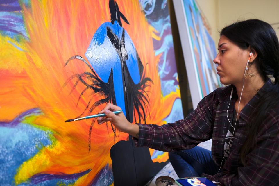 Savannah Tallbear works on her mural for this year's Fresh Paint: OKC NYE Mural Project at the OKC Farmers Public Market Monday, November 7, 2022.