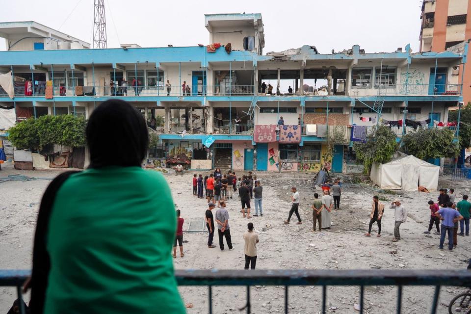 Palestinians check a UN school housing displaced people that was hit during Israeli bombardment in Nuseirat (AFP via Getty)