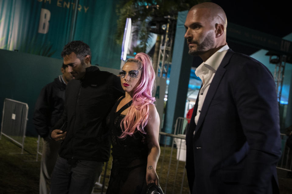 Lady Gaga and Michael Polanksy, left, leave the Super Bowl in Miami Gardens, Florida. (Photo: EVA MARIE UZCATEGUI via Getty Images)