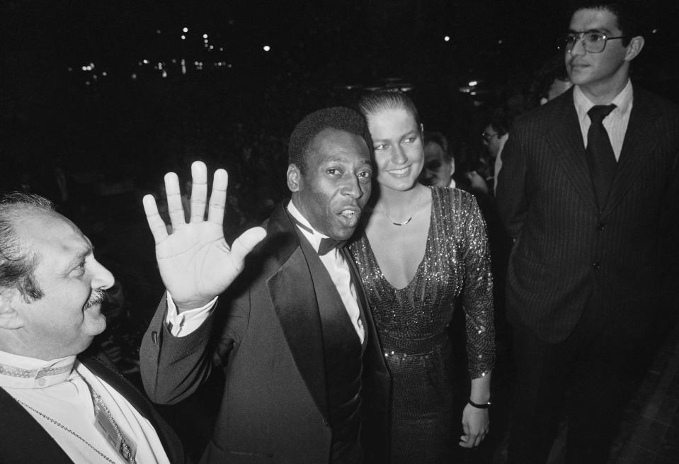 FILE - Brazilian soccer star Pele and his girlfriend Xuxa arrive to see the screening of the Spanish movie Carmen, directed by Carlos Saura, at the film festival in Cannes, France, May 15, 1983. Pelé, the Brazilian king of soccer who won a record three World Cups and became one of the most commanding sports figures of the last century, died in Sao Paulo on Thursday, Dec. 29, 2022. He was 82. (AP Photo, File)