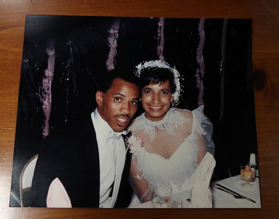 A copy of a 1985 wedding picture of Jeff and Lois Collins on Aug. 18, 2022. Collins is using teaching tennis as a way to celebrate his late wife of 36 years, Lois Collins.