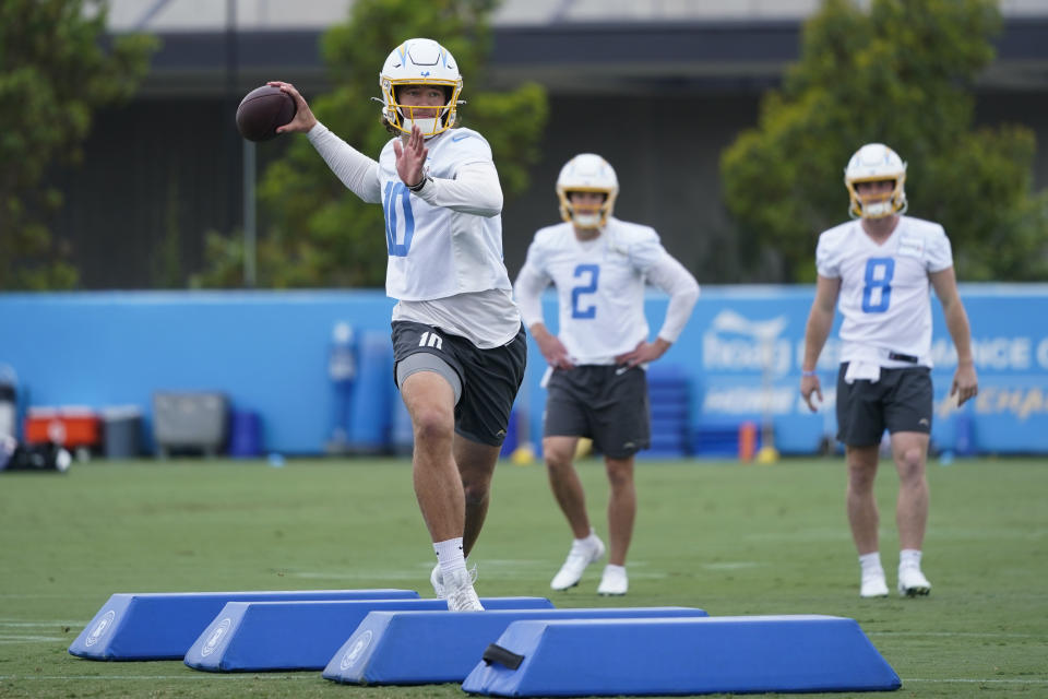 Los Angeles Chargers quarterback Justin Herbert (10) runs a drill during NFL football practice in Costa Mesa, Calif., Wednesday, June 14, 2023. (AP Photo/Jae C. Hong)