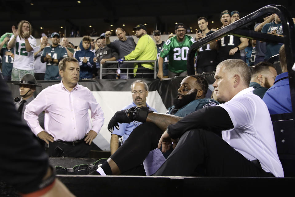 Fans cheer as Philadelphia Eagles offensive tackle Jason Peters is carted off the field. (AP)