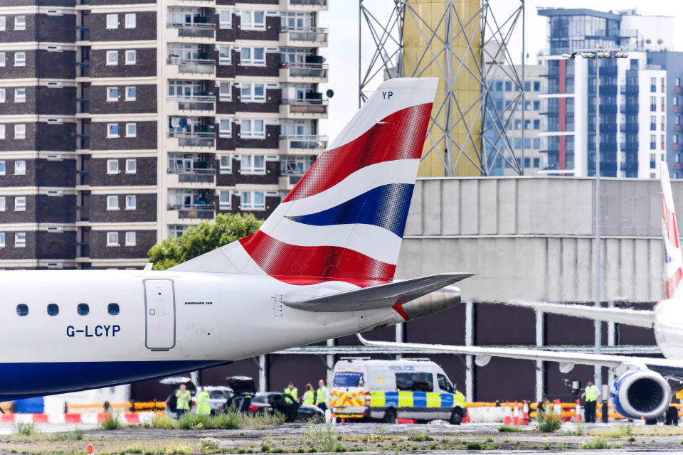 LONDON, UNITED KINGDOM - 2020/08/03: A tail of a British Airways plane seen with a Police van behind at London City Airport. British Airways confirms end of all business class LCY-JFK services from London to New York as a result of the Coronavirus (Covid-19) pandemic which has seen a decrease in passenger demand. (Photo by Dave Rushen/SOPA Images/LightRocket via Getty Images)