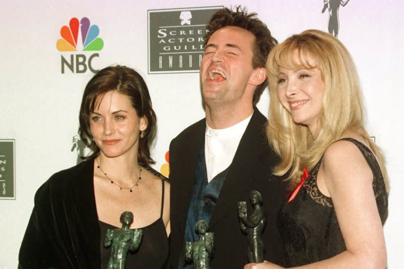 Left tor right, Courteney Cox, Matthew Perry and Lisa Kudrow -- who star in NBC's "Friends" -- pose with their trophies in 2006 after the cast was honored for best ensemble performance in a TV comedy series at the second annual Screen Actors Guild Awards in Santa Monica, Calif. File Photo by Jim Ruymen/UPI