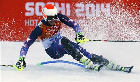 Bode Miller of the U.S. skis during the slalom run of the men's alpine skiing super combined event at the 2014 Sochi Winter Olympics at the Rosa Khutor Alpine Center February 14, 2014. REUTERS/Ruben Sprich