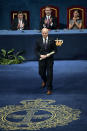 Michael Sandel of US gestures after receiving Princess of Asturias Award for Social Sciences from Spain's King Felipe VI at a ceremony in Oviedo, northern Spain, Friday Oct. 19, 2018. (AP Photo/Alvaro Barrientos)