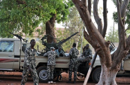 Malian soldiers stand guard on April 3 at the Kati military camp near Bamako. The soldiers who staged a putsch in Mali five weeks ago say they have defeated an overnight counter-coup by foreign-backed forces loyal to ousted president Amadou Toumani Toure