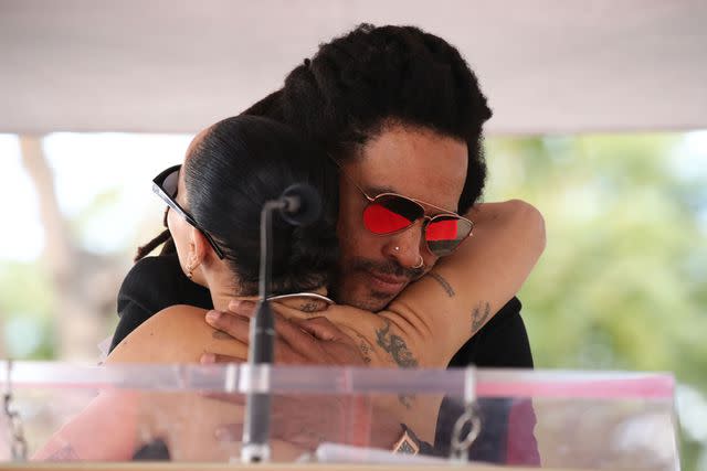 <p>Matt Baron/BEI/Shutterstock </p> Lenny Kravitz and Zoë Kravitz embrace after her speech at his Hollywood Walk of Fame ceremony