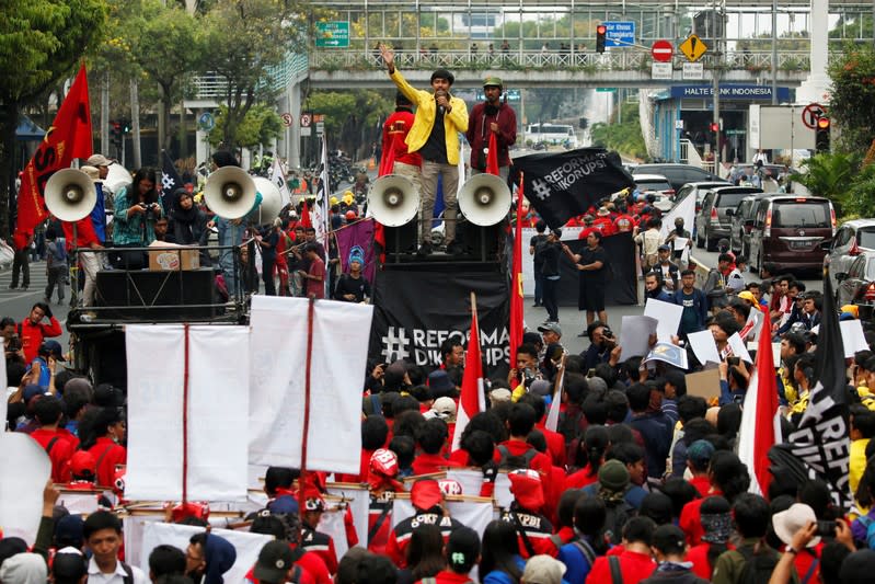 Manik Marganamahendra, a student leader at the University of Indonesia, gestures as he delivers a speech during a protest over human rights, corruption and social and environmental issues in Jakarta, Indonesia