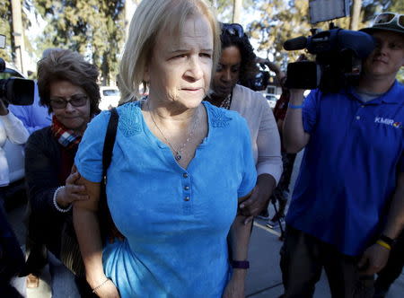 Sherry Esquerra walks into the Rudy Hernandez Community Center as she has not heard if her daughter and son-in-law were injured after a shooting rampage at the Inland Regional Center in San Bernardino, December 2, 2015. REUTERS/Alex Gallardo