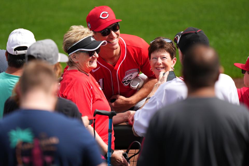 Cincinnati Reds relief pitcher Brent Suter (31) takes pictures with fans before a MLB spring training baseball game between the Cleveland Guardians and the Cincinnati Reds, Saturday, Feb. 24, 2024, at Goodyear Ballpark in Goodyear, Ariz.