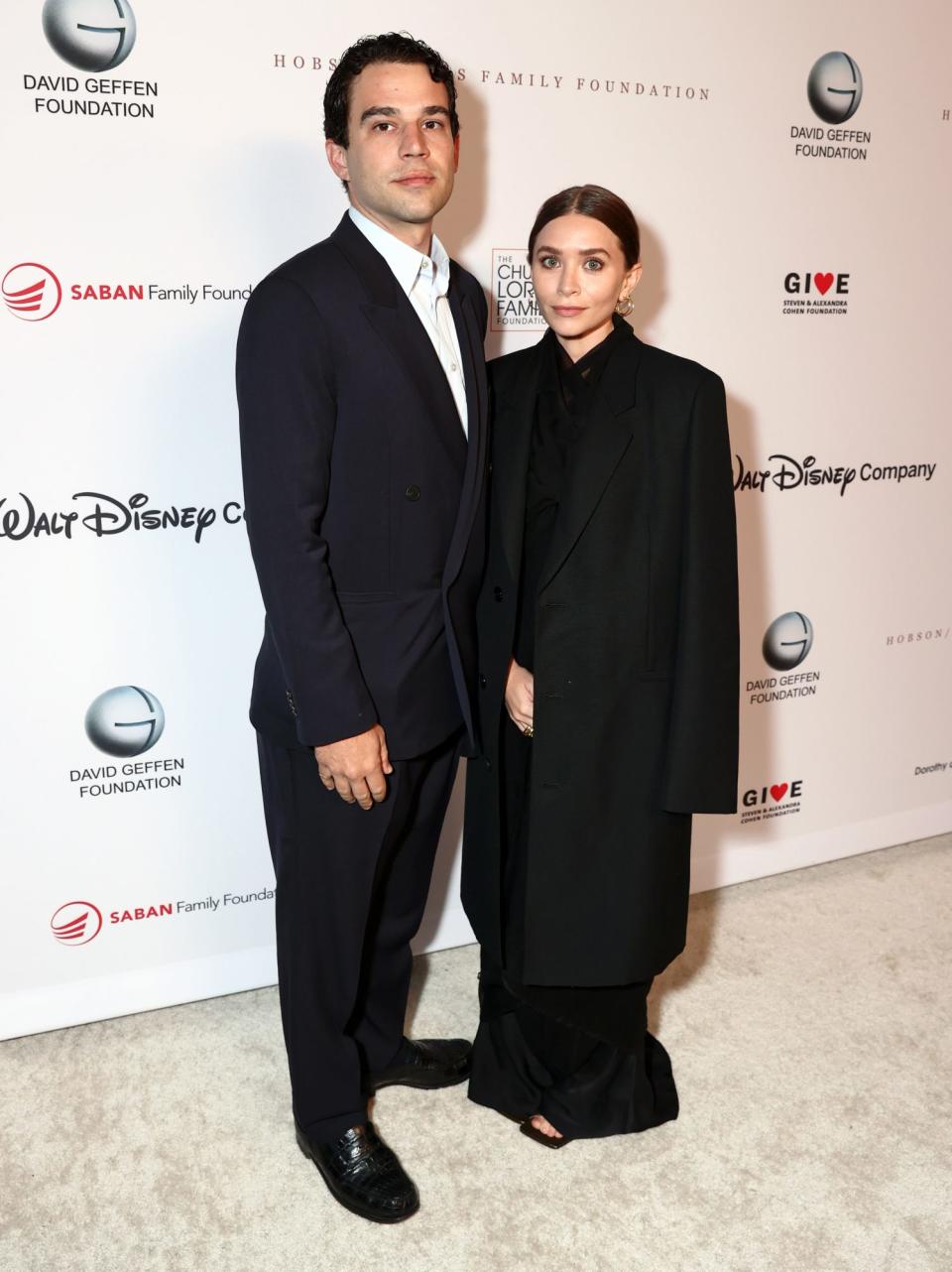 <p> Louis Eisner and Ashley Olsen coordinate in black on Sept. 23 for the YES 20th Anniversary Gala in Los Angeles. </p>