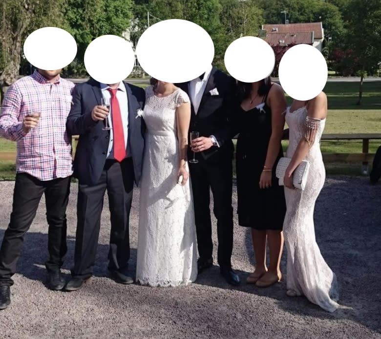 The guest (far right) upstaged the bride in a gown just as bridal as the woman of the moment. Photo: Facebook