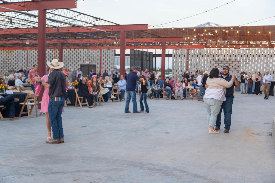 Couples enjoy a dance at the inaugural event of the new AJ Swope Performance Plaza Friday night at the Arts in the Sunset in Amarillo.