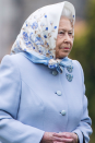 The Queen greeted Barack Obama in this pretty flora headscarf and matching blue jacket last year.