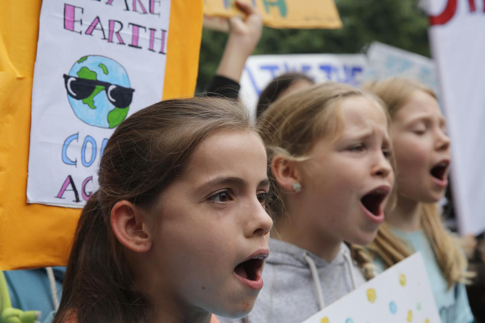 Hundreds of schoolchildren take part in a climate protest in Hong Kong, Friday, March 15, 2019. Students in more than 80 countries and territories worldwide plan to skip class Friday in protest over their governments' failure to act against global warming. The coordinated 'school strike' was inspired by 16-year-old activist Greta Thunberg, who began holding solitary demonstrations outside the Swedish parliament last year. (AP Photo/Kin Cheung)