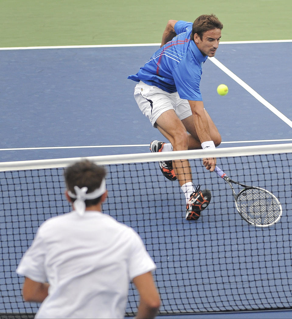 Tommy Robredo of Spain returns against Matosevic of Australia during the first round of the 2013 U.S. Open tennis tournament Monday, Aug. 26, 2013, in New York. (AP Photo/Kathy Kmonicek)