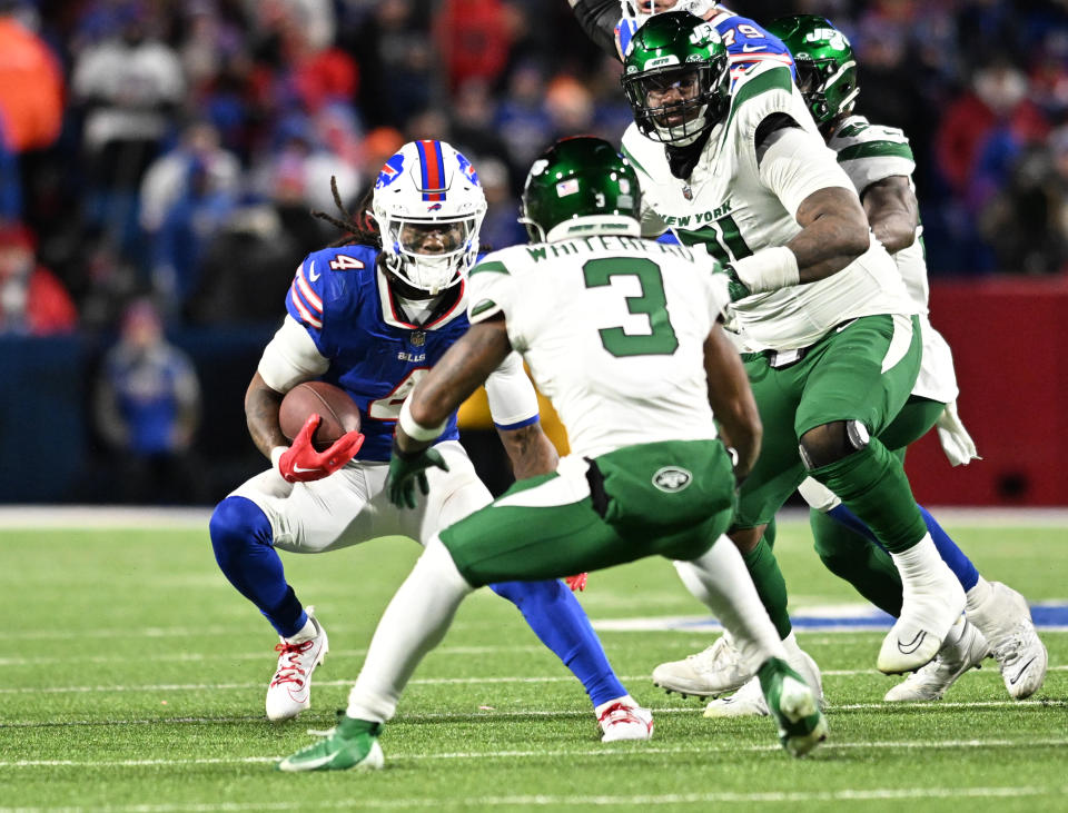 Nov 19, 2023; Orchard Park, New York, USA; Buffalo Bills running back <a class="link " href="https://sports.yahoo.com/nfl/players/34019" data-i13n="sec:content-canvas;subsec:anchor_text;elm:context_link" data-ylk="slk:James Cook;sec:content-canvas;subsec:anchor_text;elm:context_link;itc:0">James Cook</a> (4) defends New York Jets safety Jordan Whitehead (3) during a run in the fourth quarter at Highmark Stadium. Mandatory Credit: Mark Konezny-USA TODAY Sports