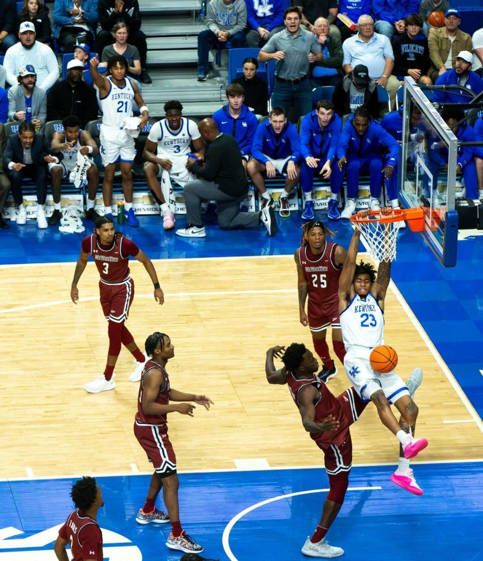 Kentucky guard Jordan Burks (23) dunks the ball against New Mexico State during Monday night’s season opener.