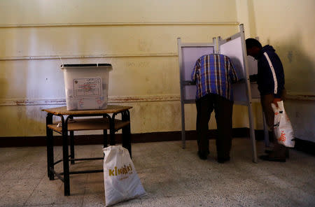 Voters fill in their ballots during the second day of the referendum on draft constitutional amendments, at a polling station in Cairo, Egypt April 21, 2019. REUTERS/Amr Abdallah Dalsh