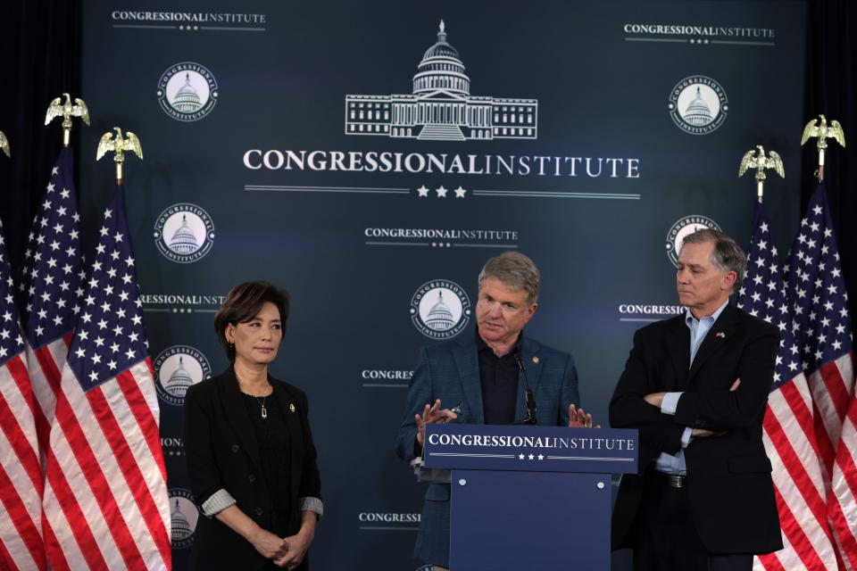 U.S. Rep. Michael McCaul, R-Texas, Chairman of the House Foreign Affairs Committee, discusses “Biden’s failed foreign policy” to members of the press as Rep. Young Kim, R-Calif., (L) and Rep. French Hill, R-Ark., listen at the Greenbrier Hotel on March 14, 2024 in White Sulphur Springs, West Virginia.