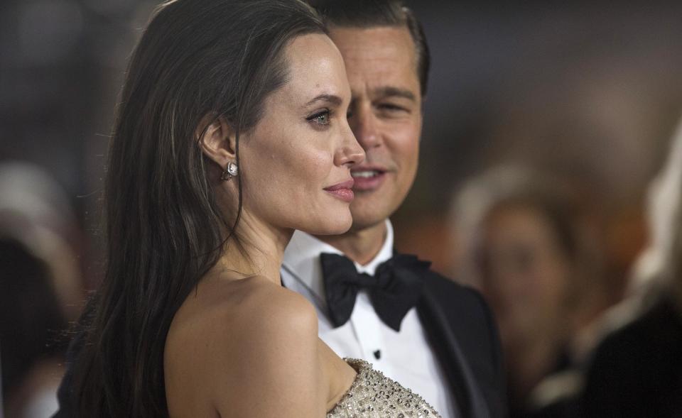 Angelina Jolie allowed Brad Pitt to bond with some of their children for Father's Day. Pictured: Angelina Jolie and Brad Pitt at the "By the Sea" premiere in Hollywood, California on Nov. 5, 2015.