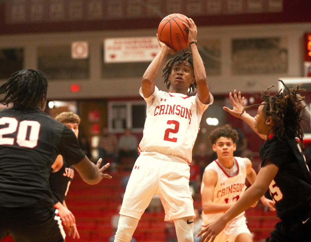 Jacksonville's Amaree Burries attempts a shot during a Central State Eight Conference boys basketball game against Springfield High at The Bowl on Saturday, Dec. 16, 2023.