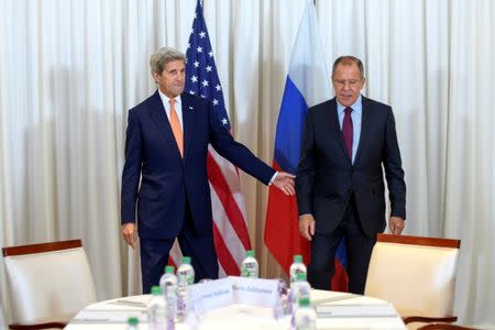 U.S. Secretary of State John Kerry (L) and Russian Foreign Minister Sergei Lavrov (R) before a bilateral meeting focused on the Syrian crisis in Geneva, Switzerland August 26, 2016. REUTERS/Martial Trezzini/Pool