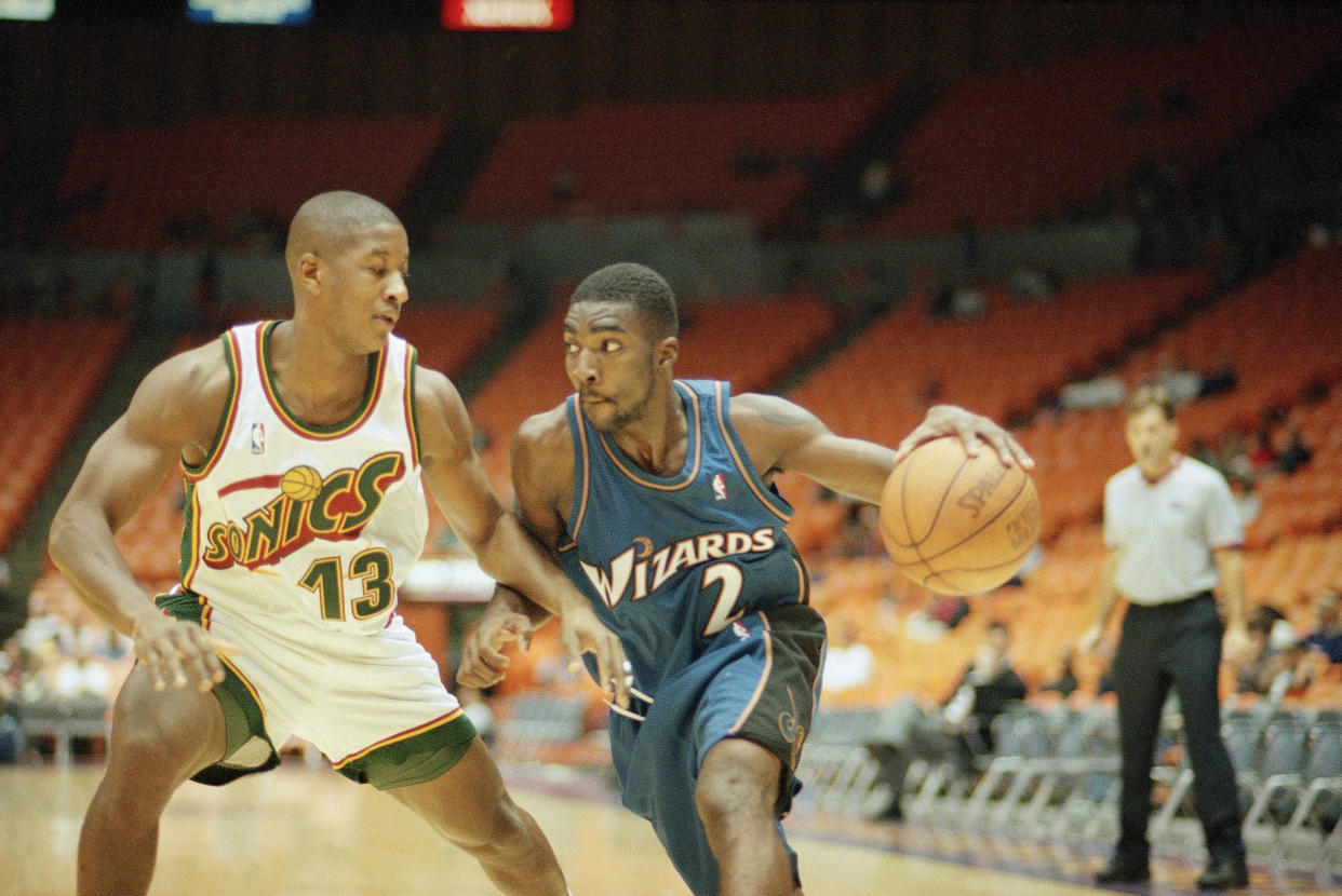 Washington Wizards? God Shammgod, right, works around Seattle Supersonics? Eric Snow during the Great Western Shootout tournament on Friday, Oct. 24, 1997 in Inglewood, Calif. (AP Photo/John Hayes)