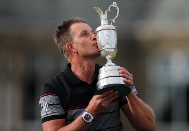 Henrik Stenson kisses the Claret Jug