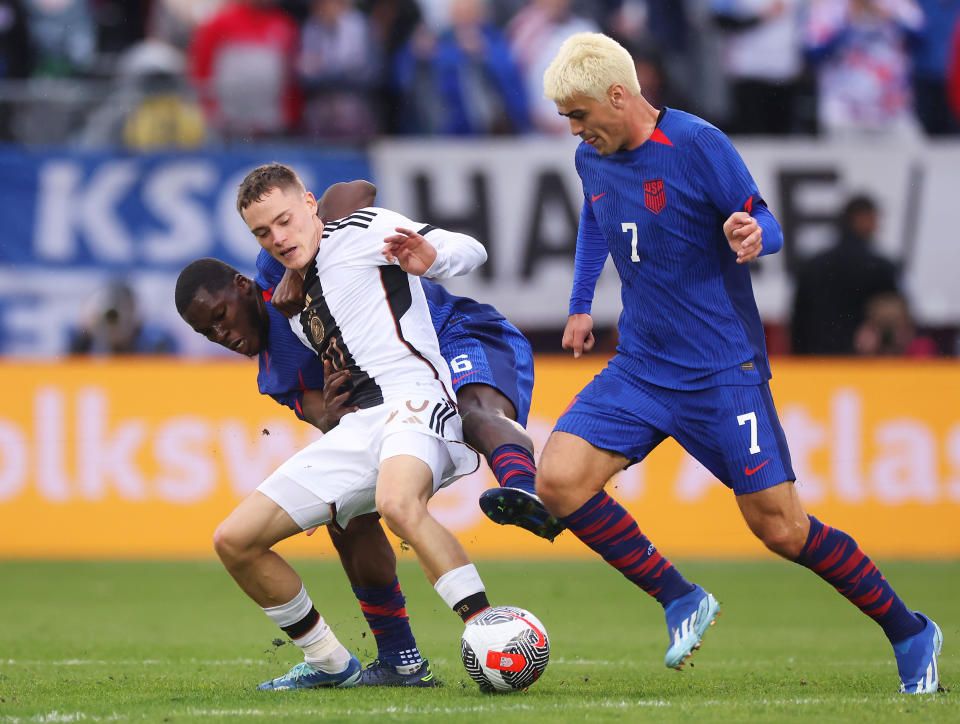Gio Reyna (7) and the USMNT have a midfield problem. So how do they solve it? (Photo by Alex Grimm/Getty Images)