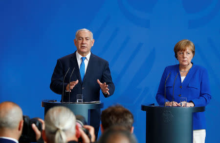 Israeli Prime Minister Benjamin Netanyahu gestures during a news conference with German Chancellor Angela Merkel in Berlin, Germany, June 4, 2018. REUTERS/Axel Schmidt
