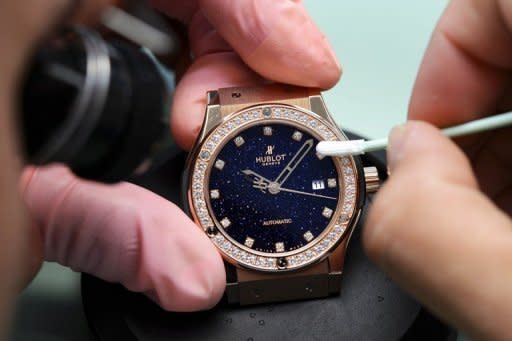 An employee of Swiss watchmaker Hublot works on a watch intended for the Chinese market. The question being mulled by famous Swiss watch brands is whether to create more specialty editions aimed at appealing specifically to the Chinese or instead simply wait for fast-shifting Chinese tastes to adapt to European fashion