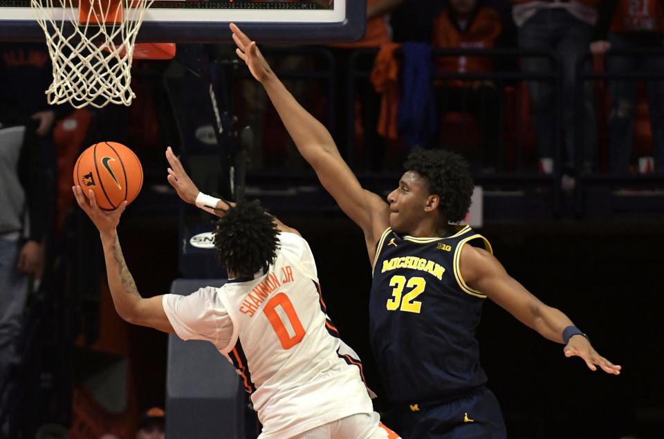 Michigan Wolverines forward Tarris Reed Jr. (32) tries to block the shot of Illinois Fighting Illini guard Terrence Shannon Jr. (0) during the second half at State Farm Center in Champaign, Illinois, on Thursday, March 2, 2023.