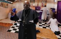 Father Marikos Otieno leads a mass, amid concerns about the spread of coronavirus disease (COVID-19) at the St. Joanes, Legio Maria African Mission church within Fort Jesus in Kibera slums of Nairobi