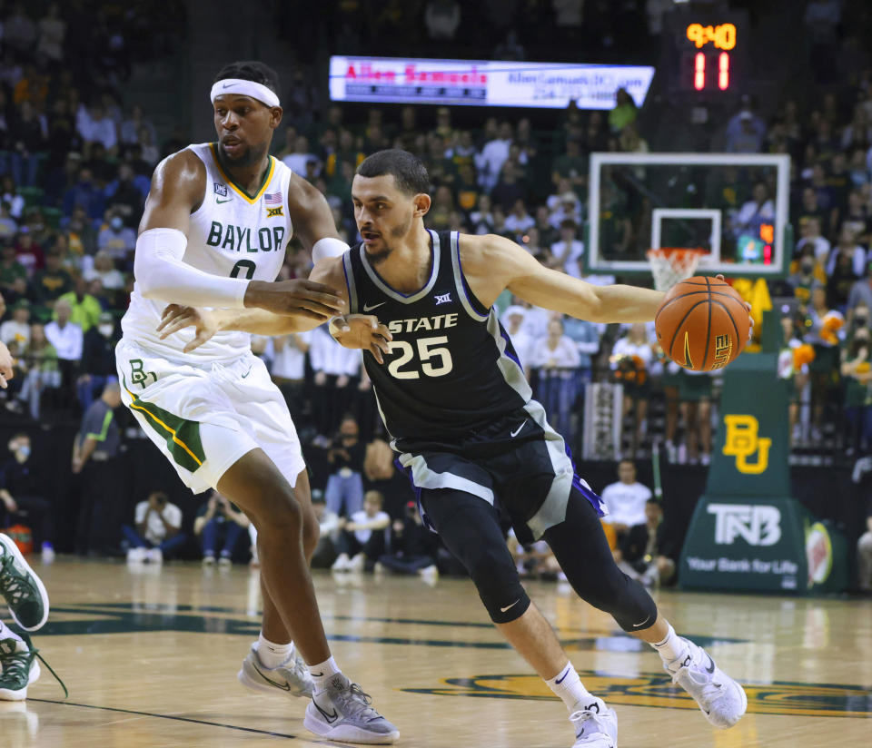 Kansas State forward Ismael Massoud, right, drives on Baylor forward Flo Thamba, left, in the first half of an NCAA college basketball game, Tuesday, Jan. 25, 2022, in Waco, Texas. (Rod Aydelotte/Waco Tribune Herald, via AP)